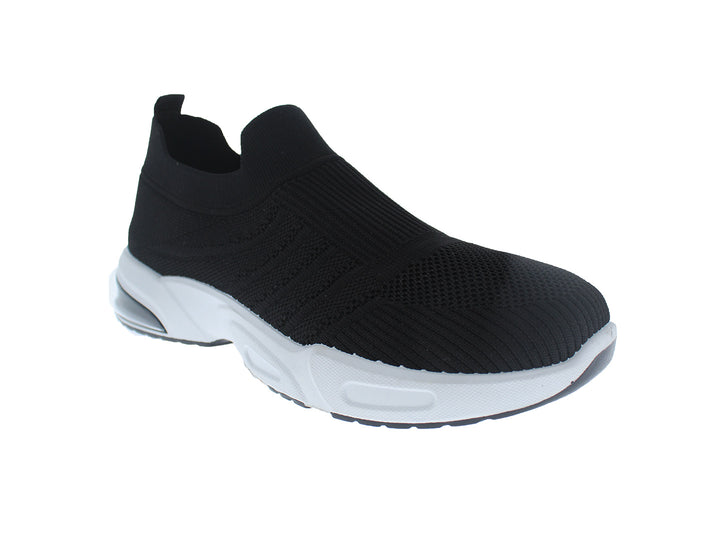Tenis deportivos FUROR color negro con suela blanca, diseño slip-on de tela tejida.