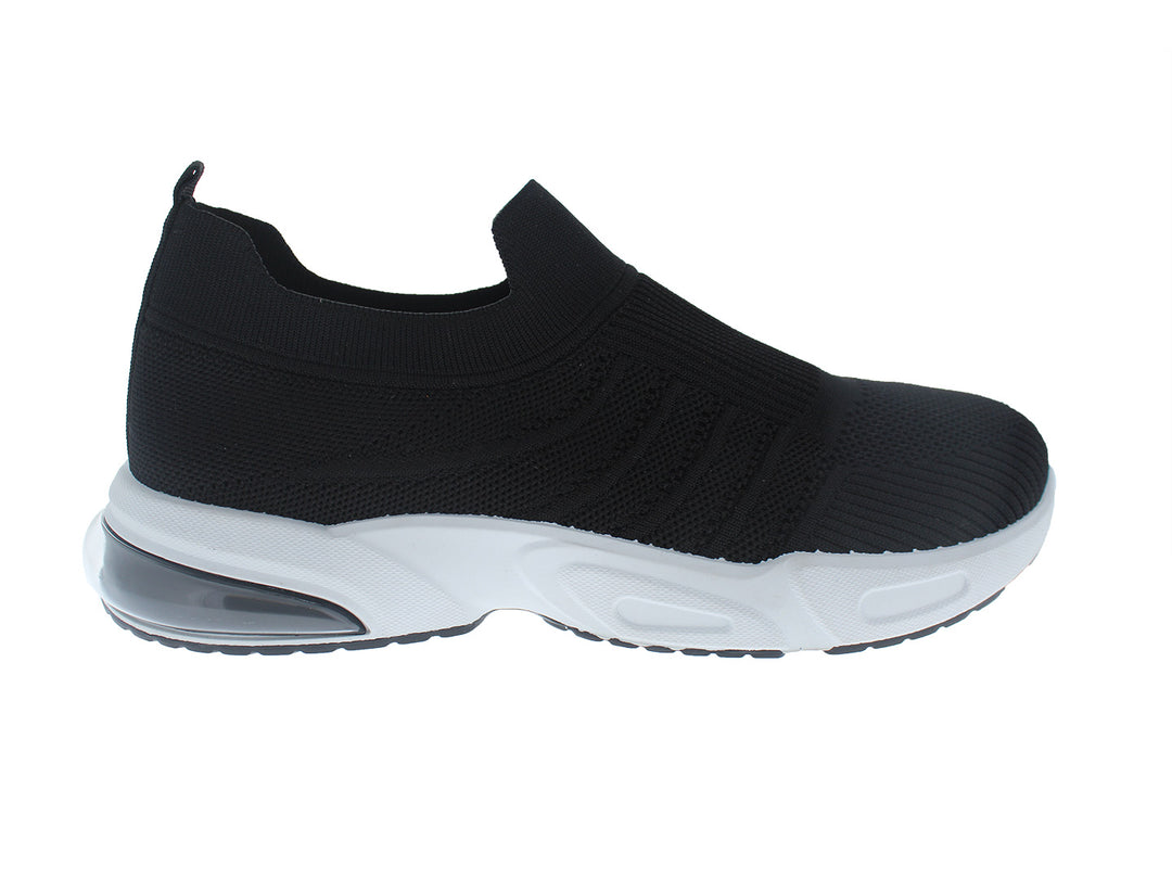 Tenis deportivos FUROR color negro con suela blanca, diseño slip-on de tela tejida.