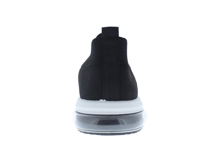 Tenis deportivos FUROR color negro con suela blanca, diseño slip-on de tela tejida.