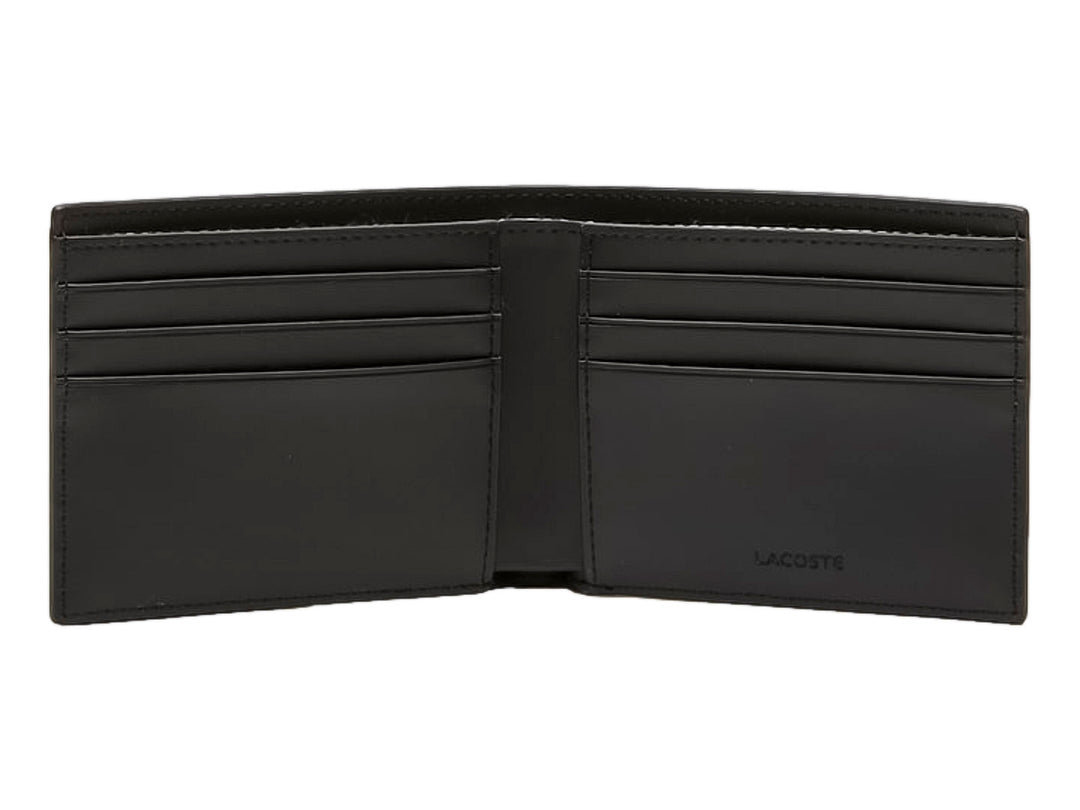 Cartera Lacoste color negro con estampado de monogramas en gris y logotipo del cocodrilo en verde.