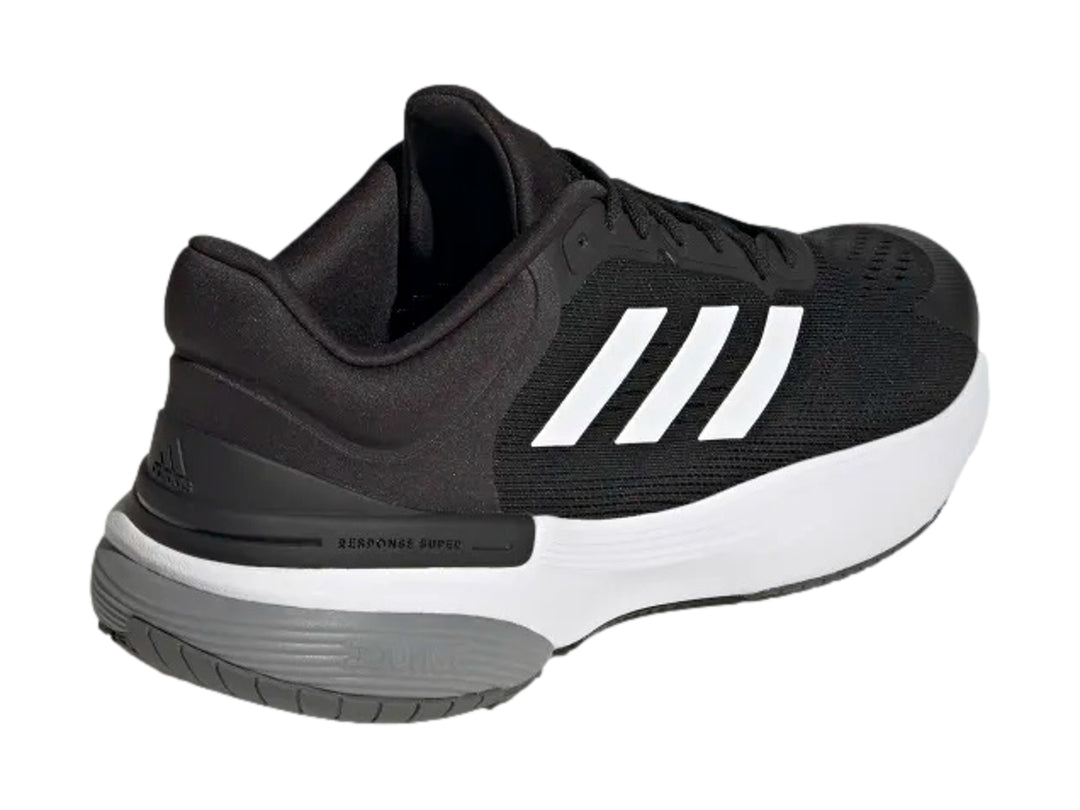 Tenis deportivos Adidas Response Super 3.0 color negro con suela blanca y gris.