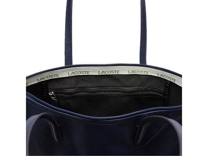 Bolso de hombro Lacoste modelo NF1890 en color azul marino con asas largas y logotipo frontal.