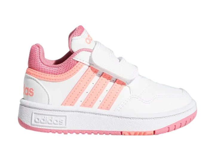 Tenis Adidas blancos con detalles en rosa y cierre de velcro para niños.