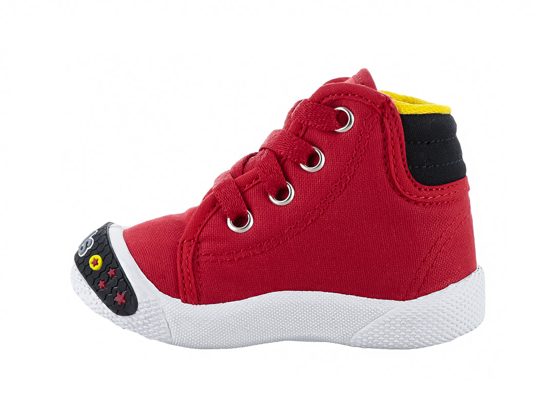 Zapato tipo tenis para bebé en color rojo con suela blanca y detalles en negro.