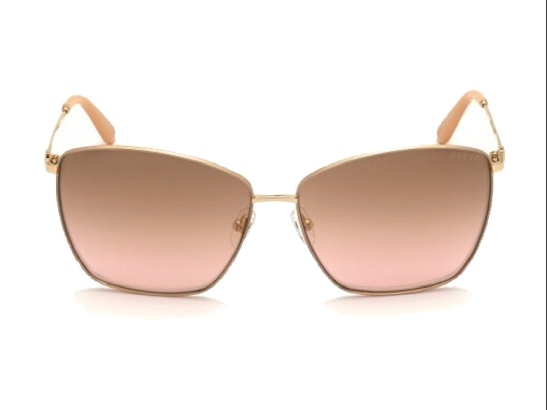 Lentes de sol Guess para mujer con montura metálica dorada y cristales cuadrados en tono marrón degradado.