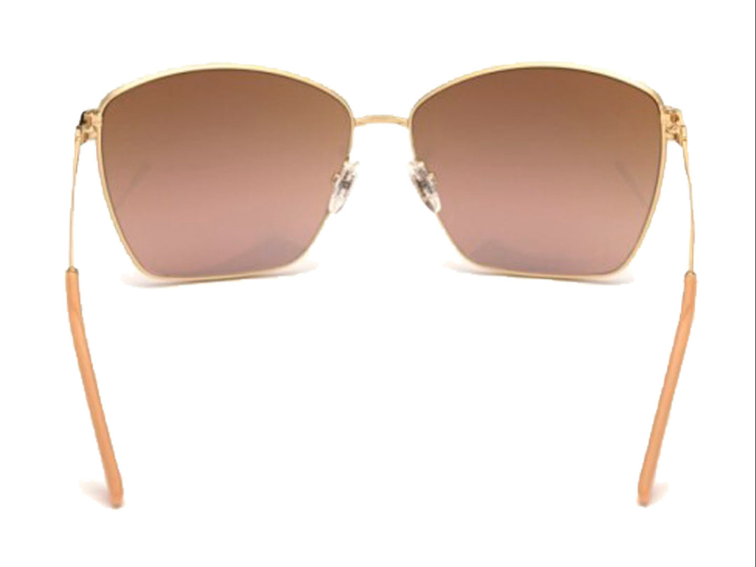 Lentes de sol Guess para mujer con montura metálica dorada y cristales cuadrados en tono marrón degradado.