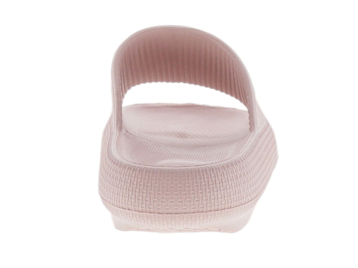 Sandalia deslizante de material EVA en color rosa con textura granulada y suela gruesa.