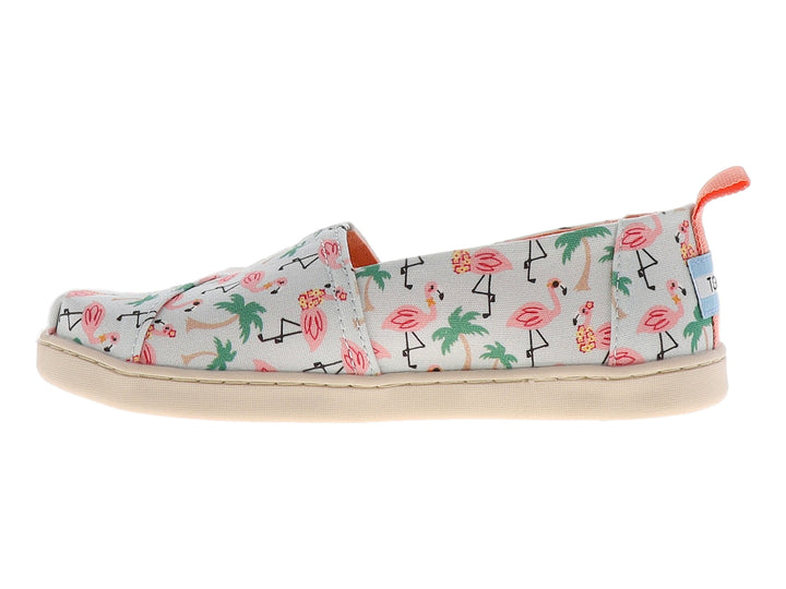 Zapato slip-on blanco con estampado de flamencos rosas y palmeras verdes.