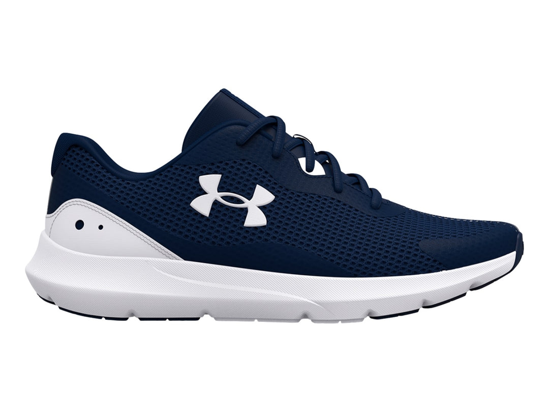 Tenis deportivos Under Armour color azul marino con suela blanca y logotipo blanco.