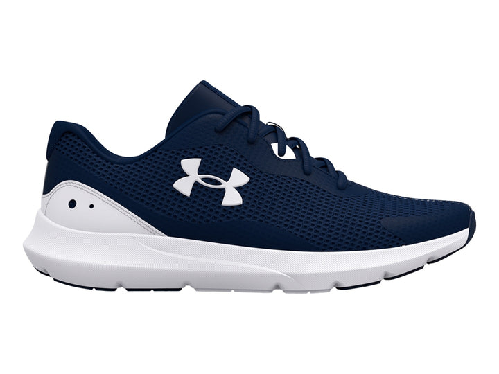Tenis deportivos Under Armour color azul marino con suela blanca y logotipo blanco.
