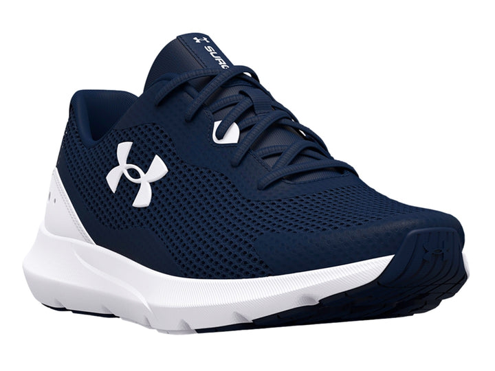 Tenis deportivos Under Armour color azul marino con suela blanca y logotipo blanco.
