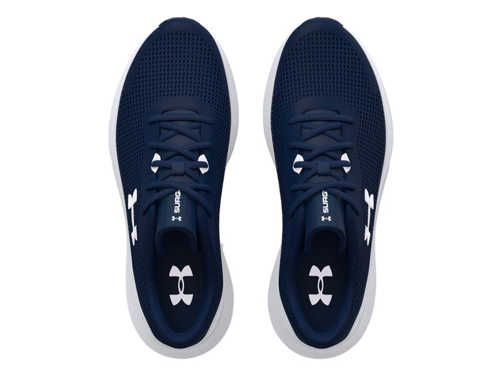 Tenis deportivos Under Armour color azul marino con suela blanca y logotipo blanco.