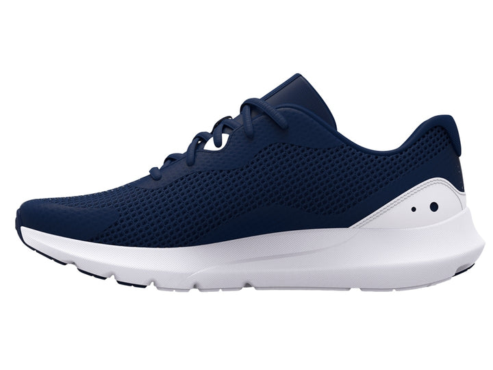 Tenis deportivos Under Armour color azul marino con suela blanca y logotipo blanco.