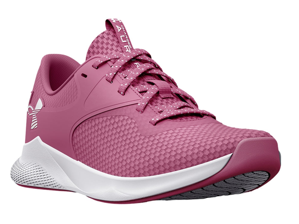 Tenis deportivos Under Armour color rosa con suela blanca y logotipo blanco lateral.