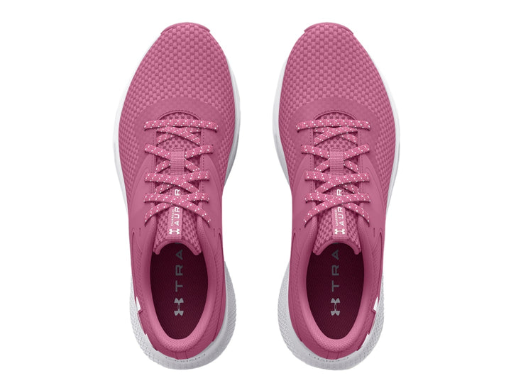 Tenis deportivos Under Armour color rosa con suela blanca y logotipo blanco lateral.