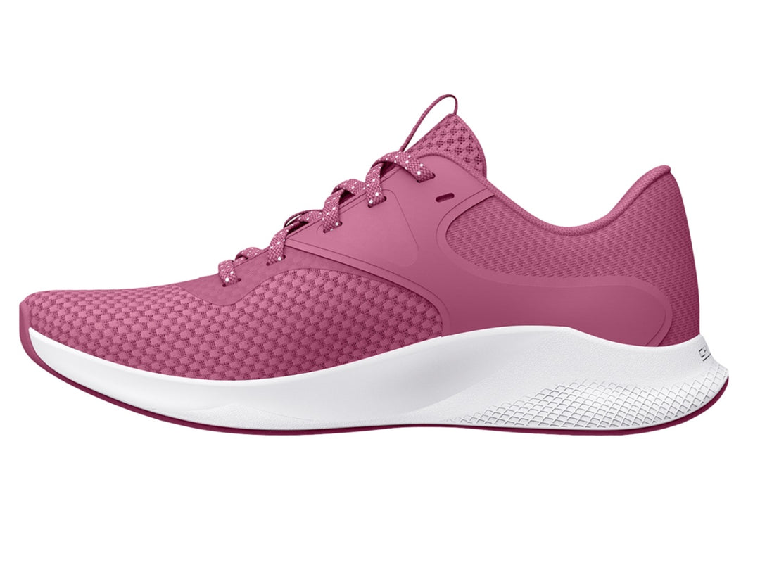 Tenis deportivos Under Armour color rosa con suela blanca y logotipo blanco lateral.