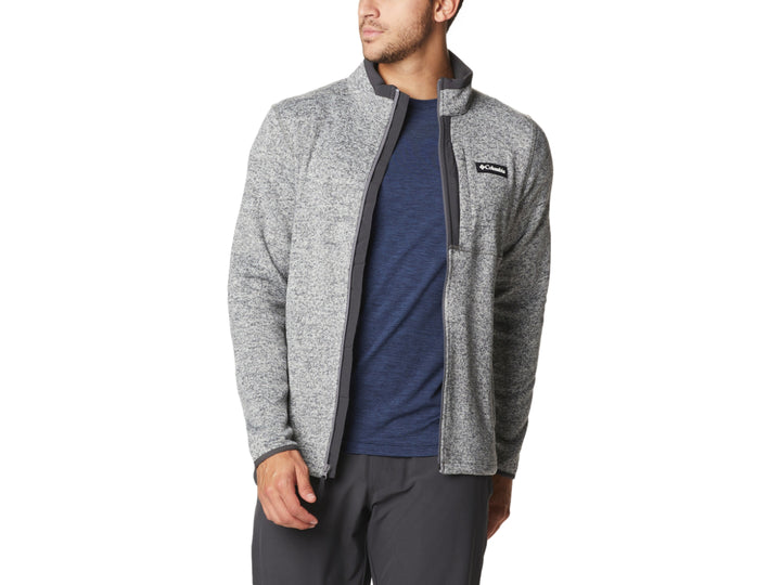 Hombre vistiendo sudadera Columbia color gris jaspeado con cierre frontal y cuello alto.