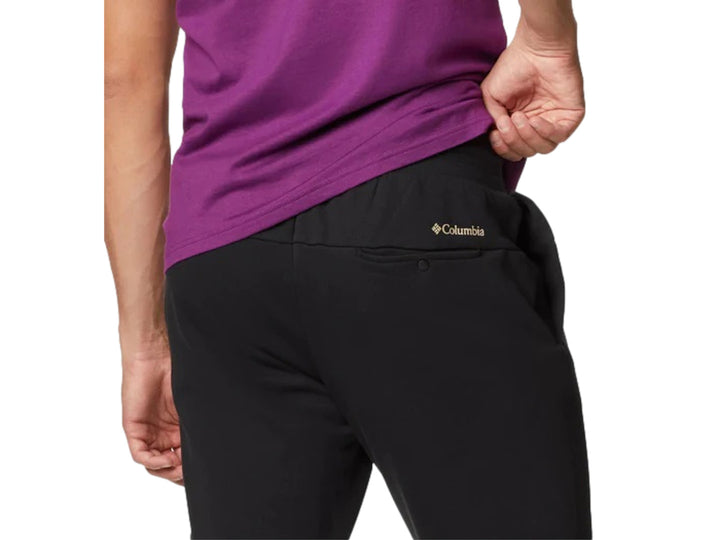 Pantalones jogger Columbia color-block en colores verde oliva y negro con puños elásticos.