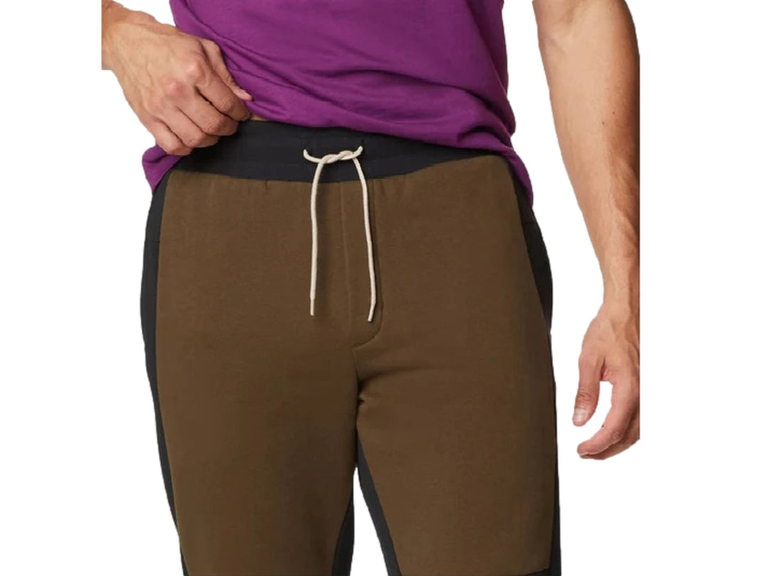 Pantalones jogger Columbia color-block en colores verde oliva y negro con puños elásticos.