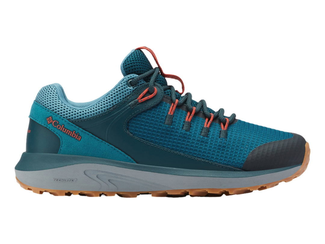 Zapato deportivo Columbia Trailstorm color azul y gris con suela marrón para senderismo.