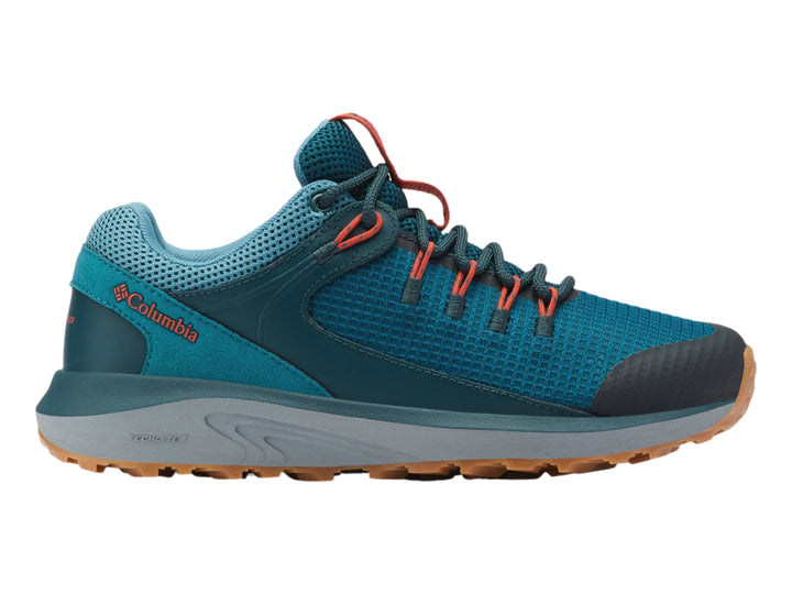 Zapato deportivo Columbia Trailstorm color azul y gris con suela marrón para senderismo.