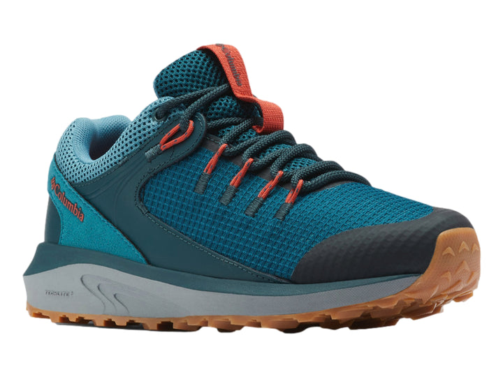Zapato deportivo Columbia Trailstorm color azul y gris con suela marrón para senderismo.
