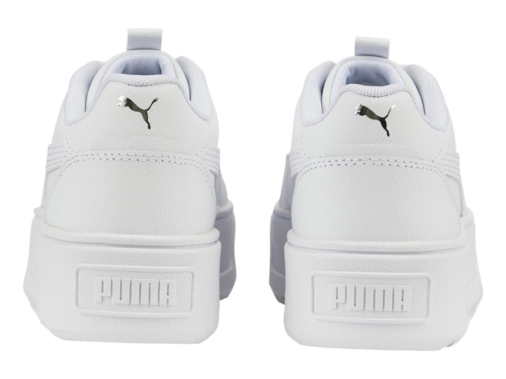 Tenis PUMA blancos de plataforma con suela gruesa y cordones.
