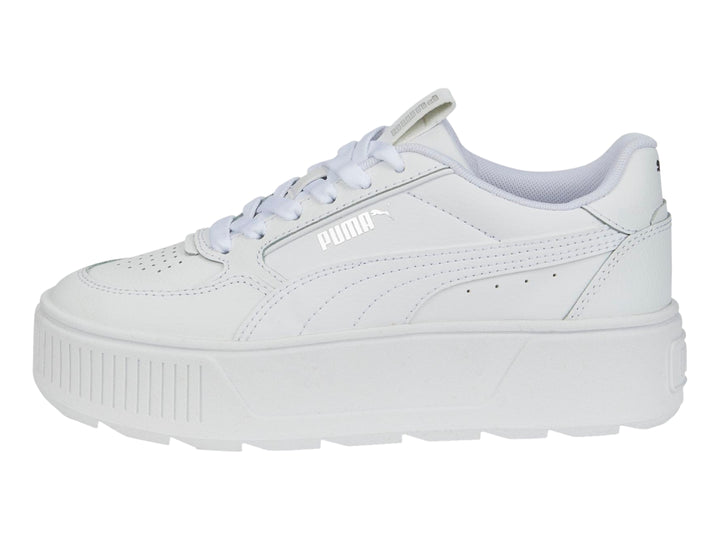 Tenis PUMA blancos de plataforma con suela gruesa y cordones.