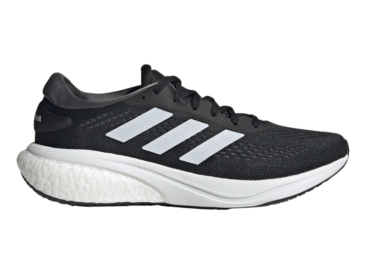 Tenis deportivos Adidas Supernova 2.0 en color negro con franjas y suela blanca.
