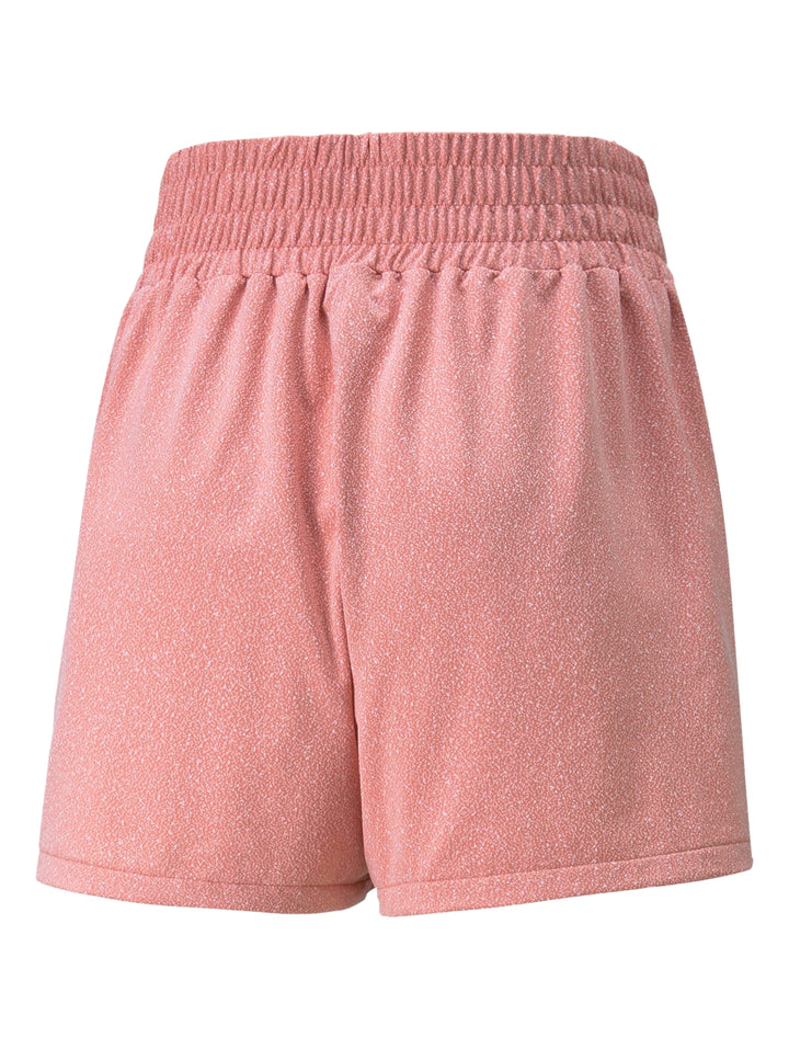Shorts deportivos PUMA color rosette para mujer con cintura elástica.