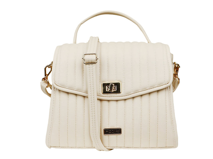 Bolso de hombro Modare color creme con textura acolchada, asa superior y detalles metálicos en dorado.