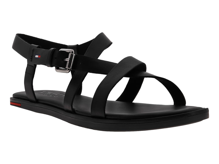 Sandalia negra para mujer de Tommy Hilfiger con tiras cruzadas y hebilla metálica plateada.