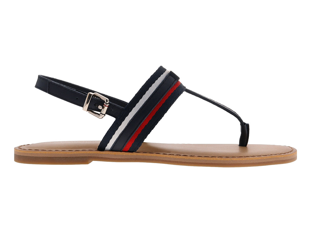 Sandalia plana Tommy Hilfiger azul marino con detalles en rojo y blanco y suela color beige.