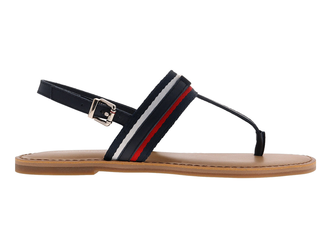 Sandalia plana Tommy Hilfiger azul marino con detalles en rojo y blanco y suela color beige.