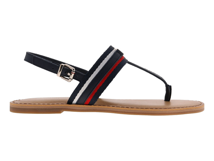 Sandalia plana Tommy Hilfiger azul marino con detalles en rojo y blanco y suela color beige.
