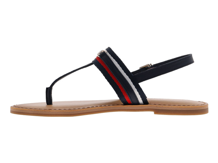 Sandalia plana Tommy Hilfiger azul marino con detalles en rojo y blanco y suela color beige.