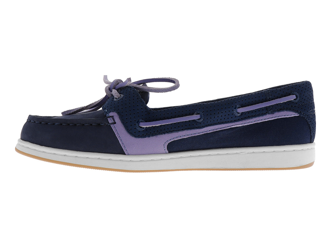 Zapato náutico Sperry color azul marino con detalles en morado y suela blanca.