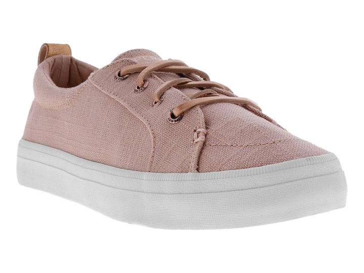 Tenis Sperry de color rosa con suela blanca y cordones, fabricados en tela de lino.