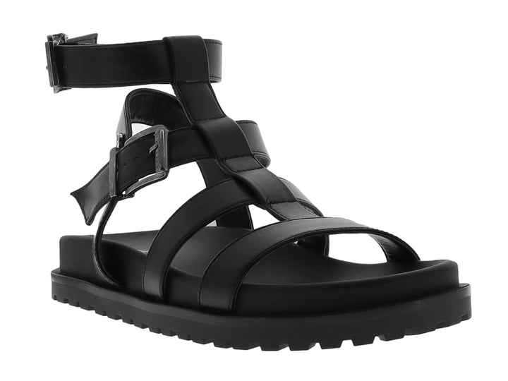 Sandalia negra de plataforma para niño con correas ajustables y suela track.