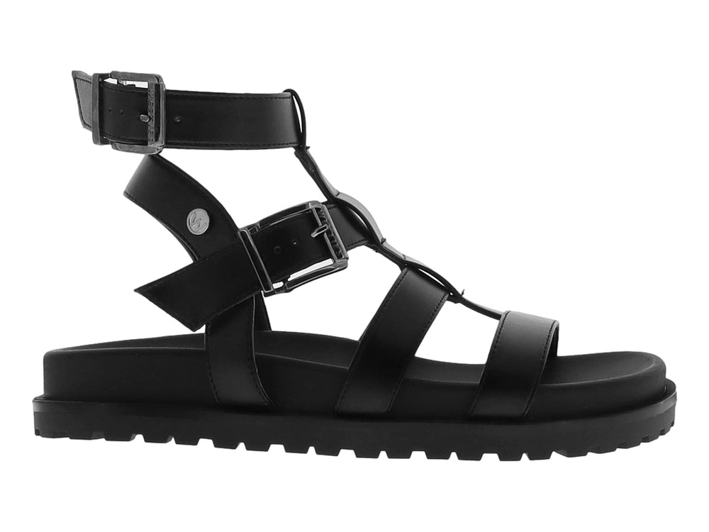 Sandalia negra de plataforma para niño con correas ajustables y suela track.