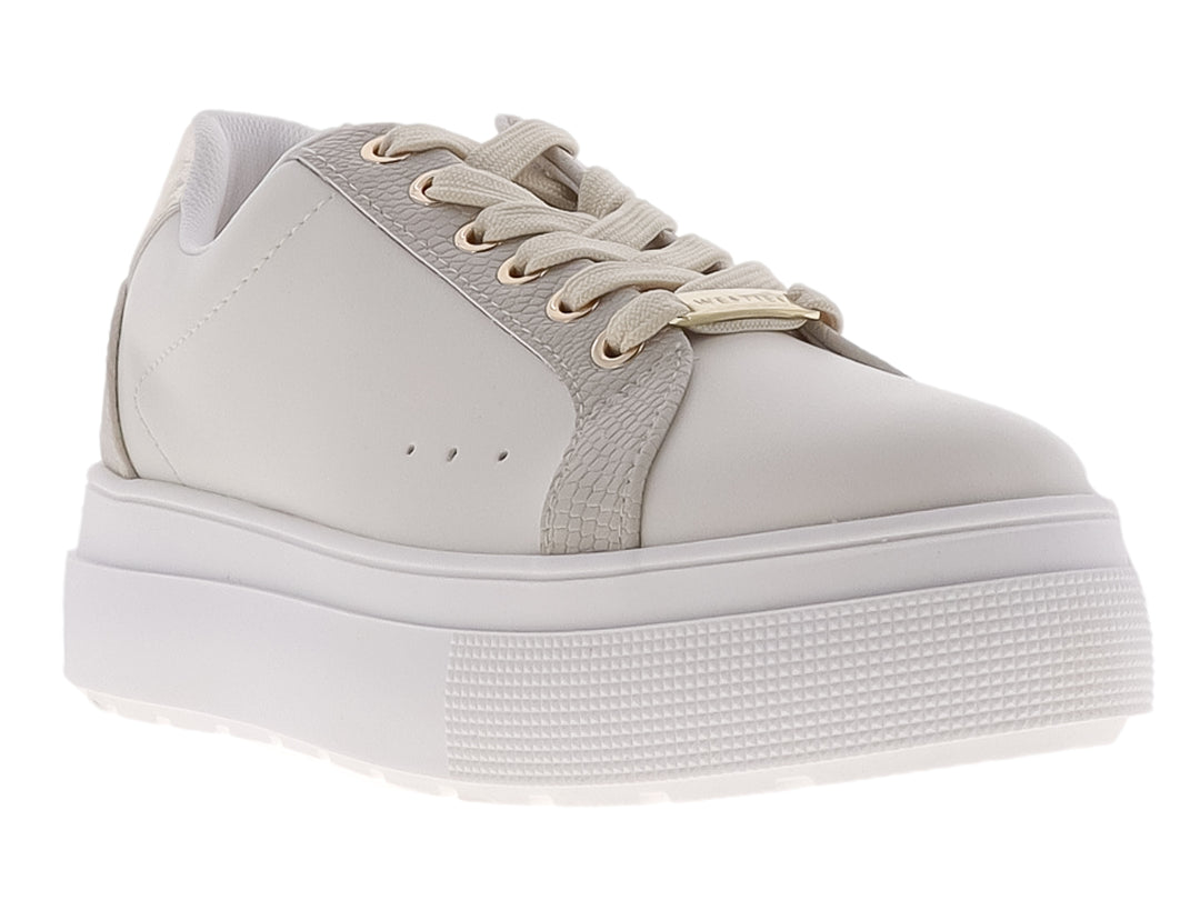Tenis Westies color ivory con suela de plataforma gruesa y acabado mate.