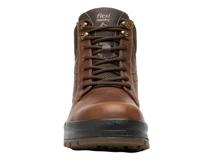 Botín Flexi color tan de cuero con suela negra y cuello textil marrón oscuro.