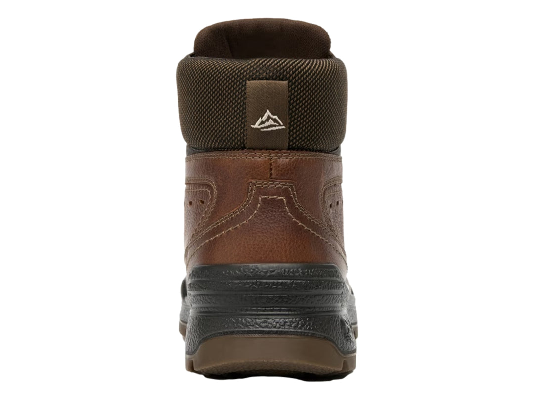 Botín Flexi color tan de cuero con suela negra y cuello textil marrón oscuro.