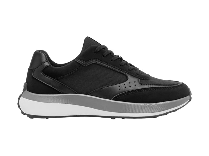 Tenis deportivos Flexi en color negro con suela blanca y gris, diseño casual y moderno.