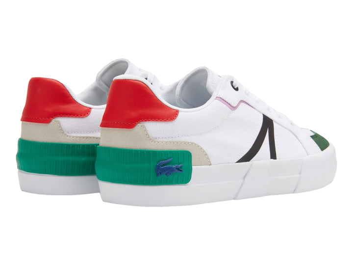 Tenis blancos Lacoste con detalles en rojo, verde y rosa y suela blanca.