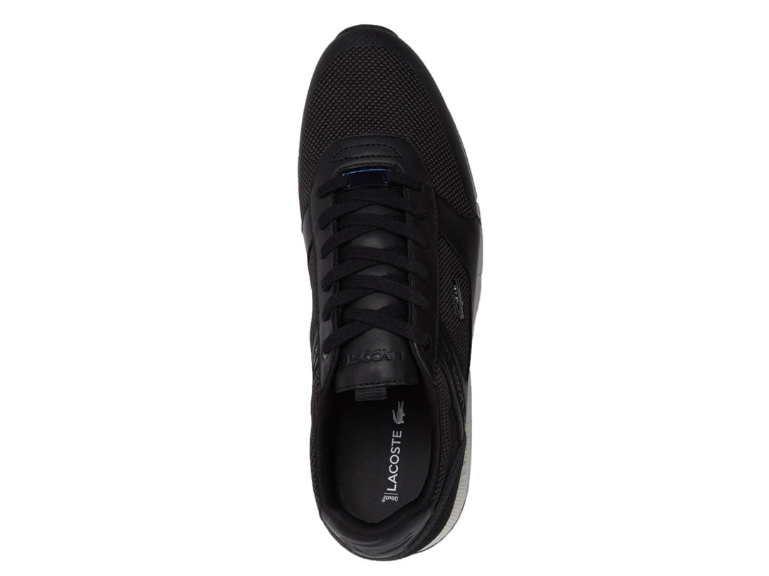 Tenis Lacoste Menerva color negro con suela blanca y detalles de malla.