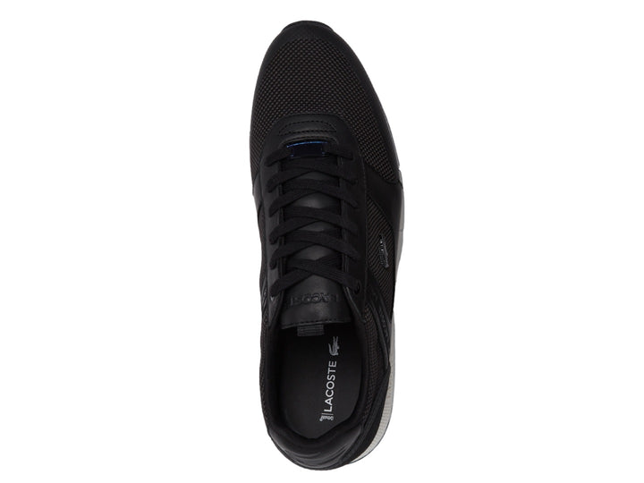 Tenis Lacoste Menerva color negro con suela blanca y detalles de malla.