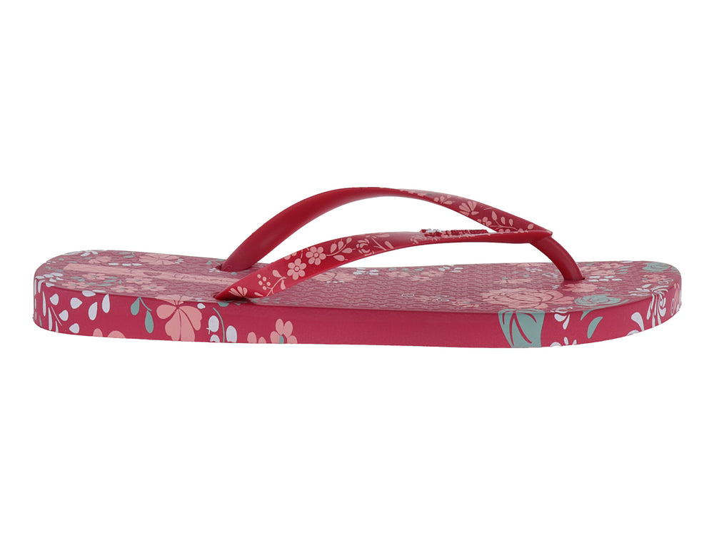 Sandalias Ipanema color rosa con estampado floral en tonos blanco y azul claro.