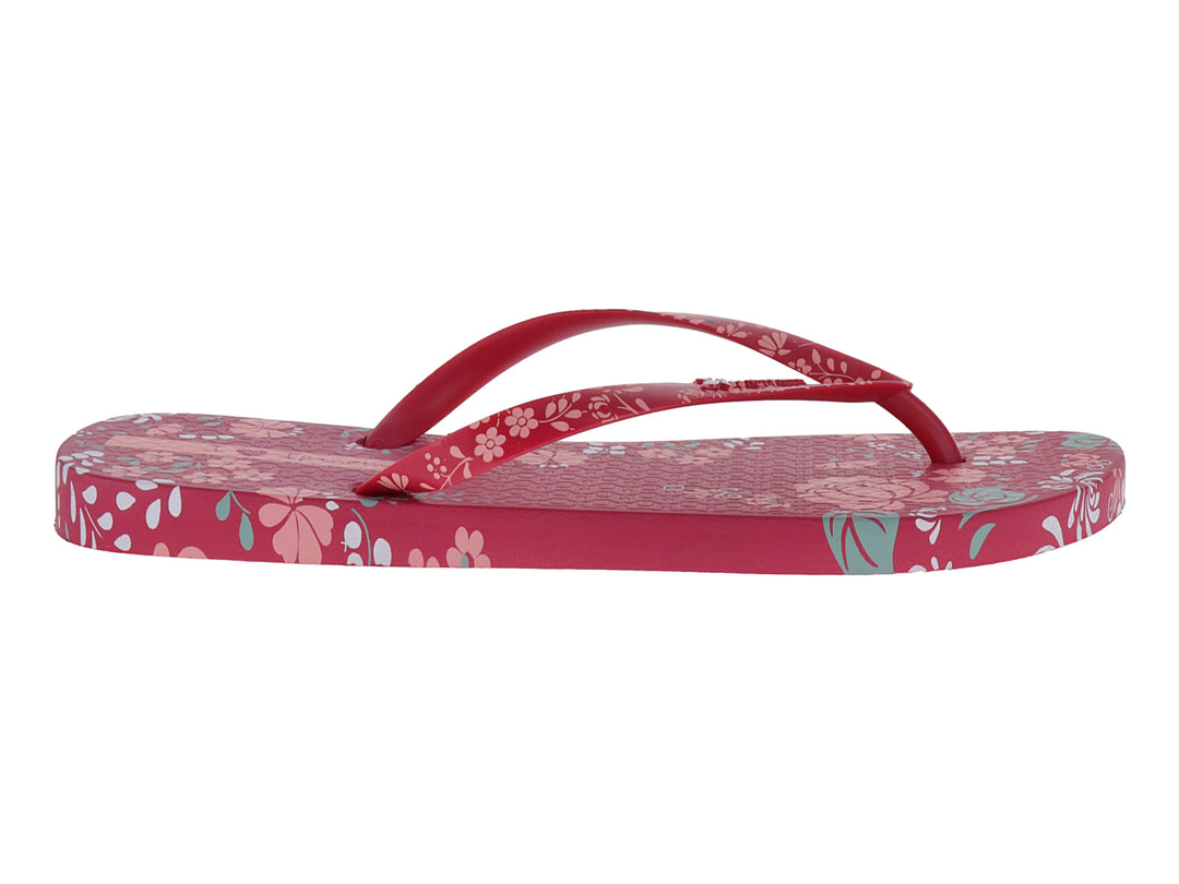 Sandalias Ipanema color rosa con estampado floral en tonos blanco y azul claro.