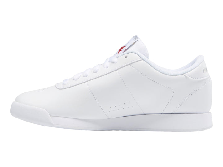Tenis deportivos Reebok color blanco con suela blanca y detalles en el lateral.
